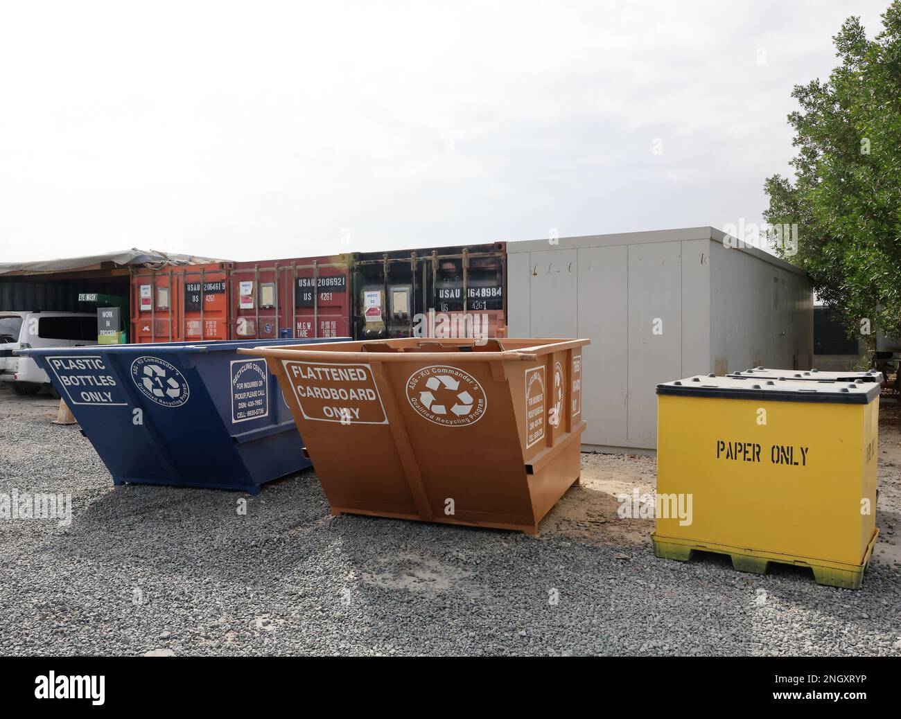 The three recycling bins plastic, cardboard, paper that are part of the Commander's
