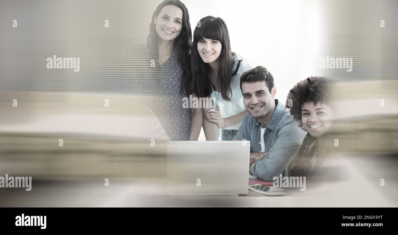 Composition of happy diverse business team using laptop with double ...