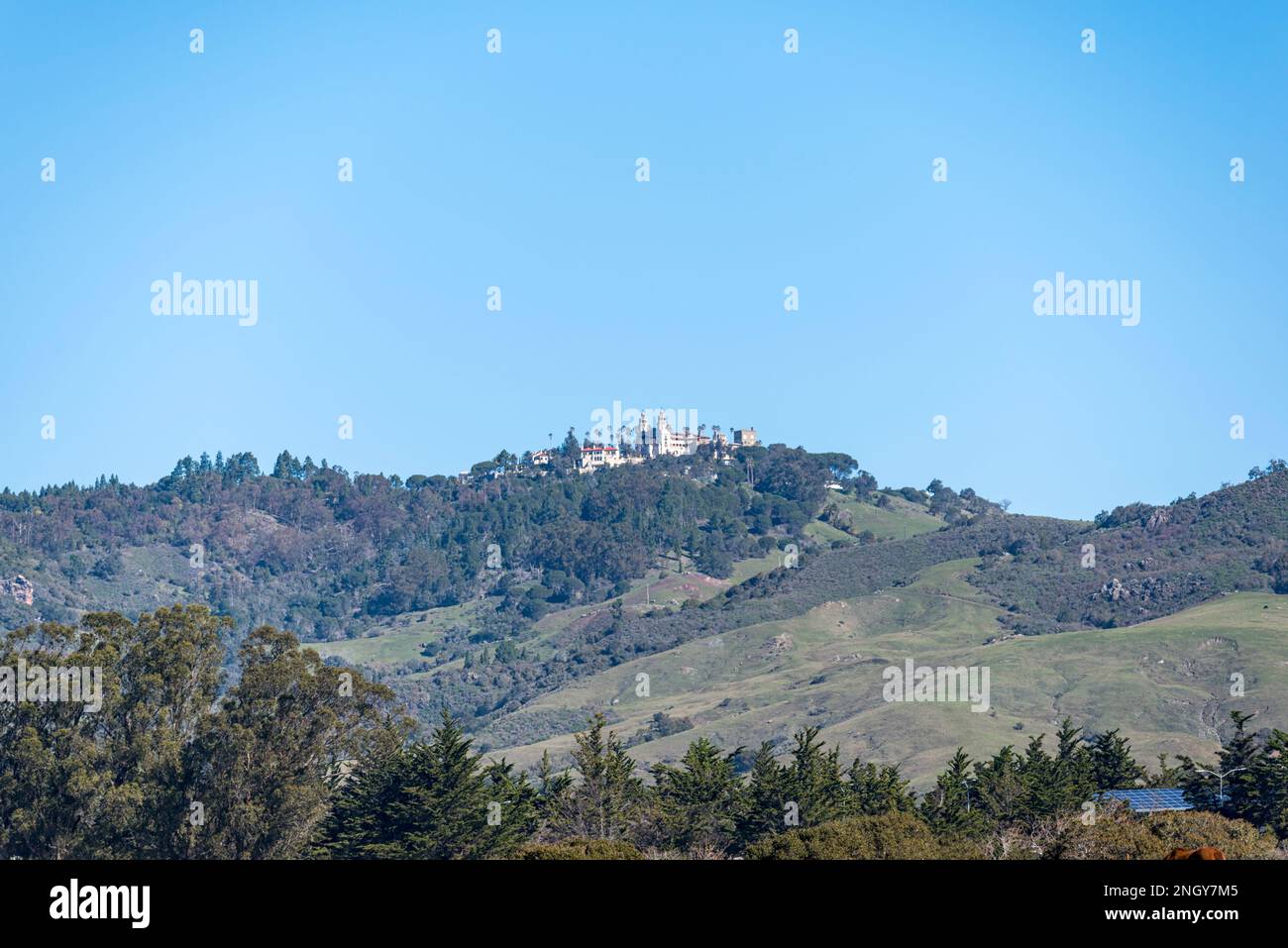 Hearst Castle on hilltop in distance. San Simeon, California, USA. Stock Photo