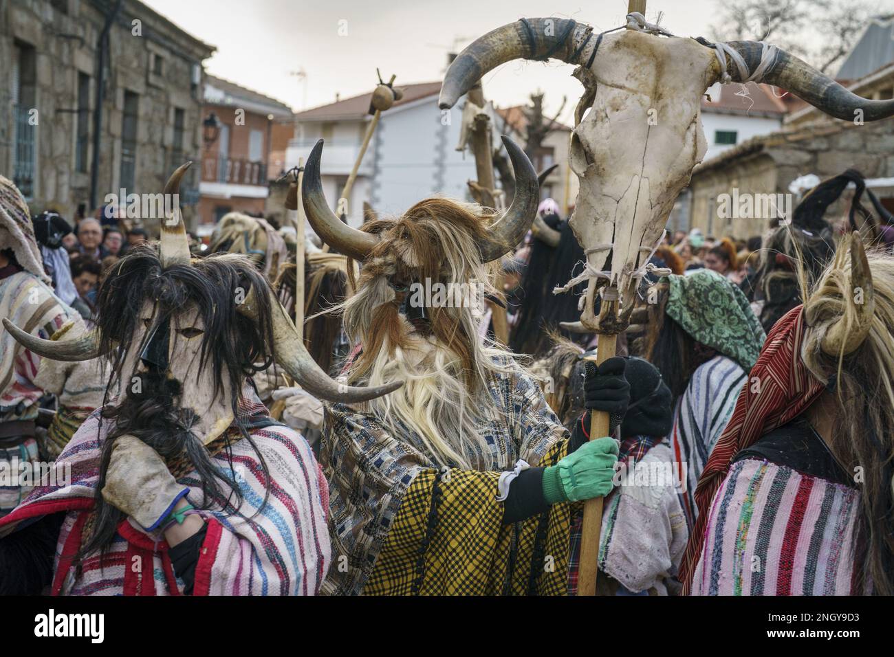 Navalosa, Spain. 19th Feb, 2023. Carnival revellers dressed as 'Cucurrumachos' with masks made out of animal parts including horse hair, ram or cow horns, and dressed with striped blankets and cowbells, take part in a traditional Fat Sunday carnival in Navalosa, Spain, on Sunday, February 19, 2023. The origins of the Cucurrumachos are believed to be Celtic and related to agriculture and animal breeding. Photo by Paul Hanna/UPI Credit: UPI/Alamy Live News Stock Photo