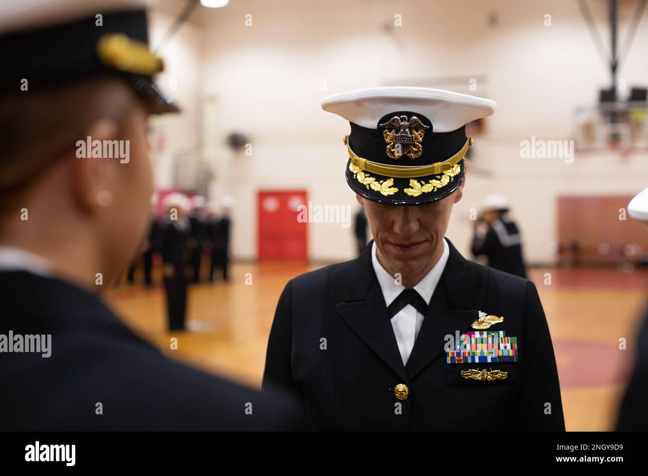 U.S. Navy Cmdr. Autumn Riddell, commanding officer, Bravo Surgical Company,  3d Medical Battalion, inspects a Sailor during a service dress blue uniform  inspection, Marine Corps Base Hawaii, Dec. 1, 2022. Bravo Surgical