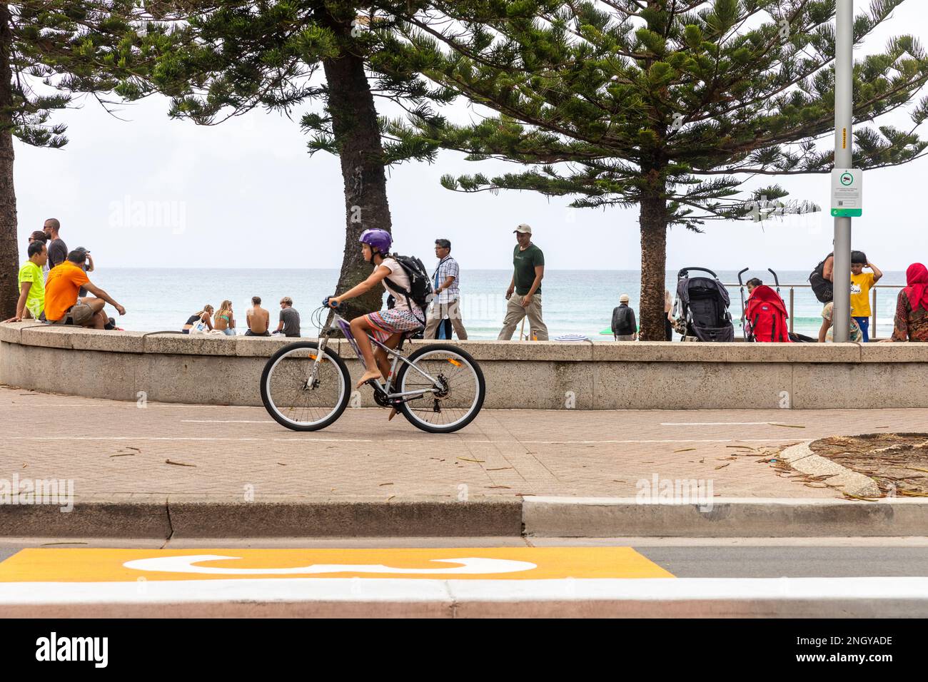 Sydney cyclist wearing bike helmet on the shared path in Manly Beach, Sydney,NSW,Australia