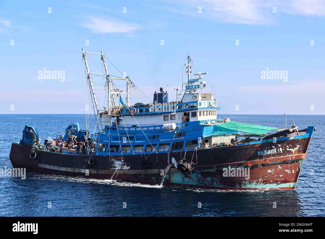 221201-N-NO146-2002 GULF OF OMAN (Dec. 1, 2022) A stateless fishing trawler intercepted by Navy personnel operating from expeditionary sea base USS Lewis B. Puller (ESB 3) transits the Gulf of Oman, Dec. 1. Forces from Lewis B. Puller found more than 1 million rounds of 7.62mm ammunition; 25,000 rounds of 12.7mm ammunition; nearly 7,000 proximity fuses for rockets; and over 2,100 kilograms of propellant used to launch rocket propelled grenades. Stock Photo