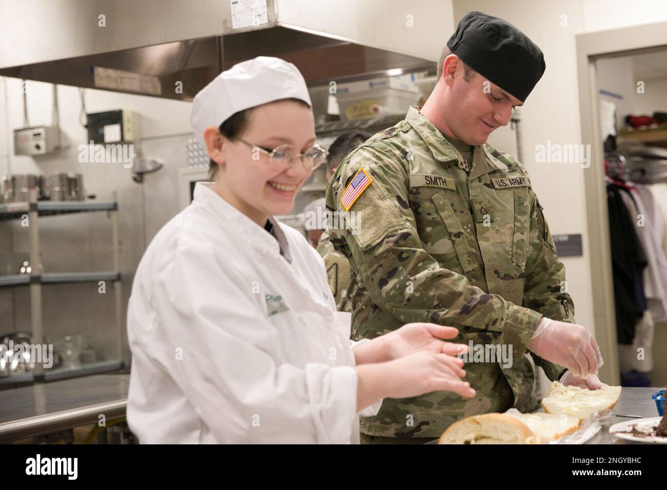 A student from Pittsburg High School chats with Pfc. James Smith, a