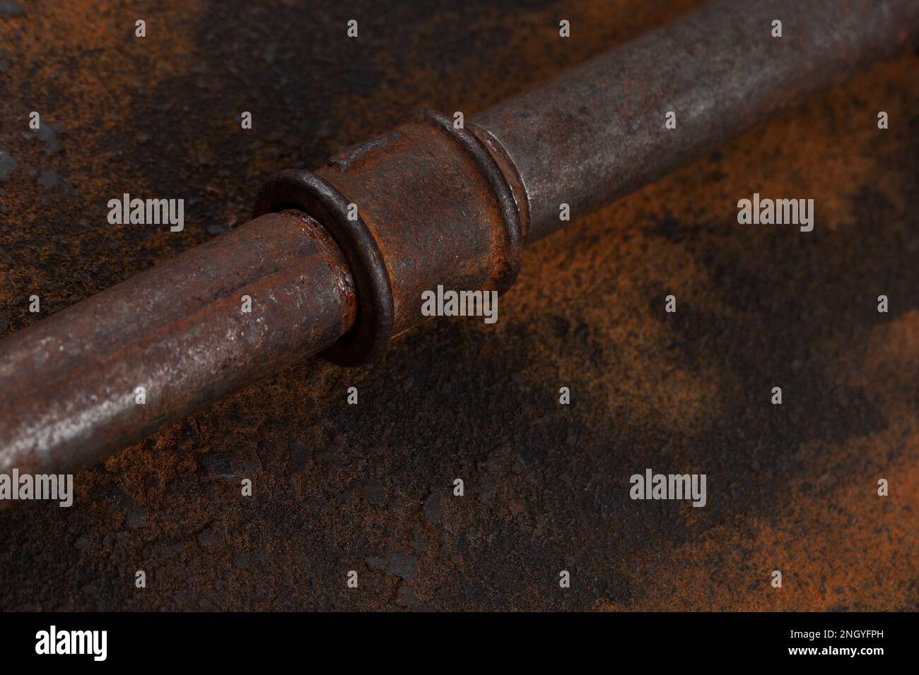 Old rusty valve pipes on rusty metal wall background Stock Photo - Alamy