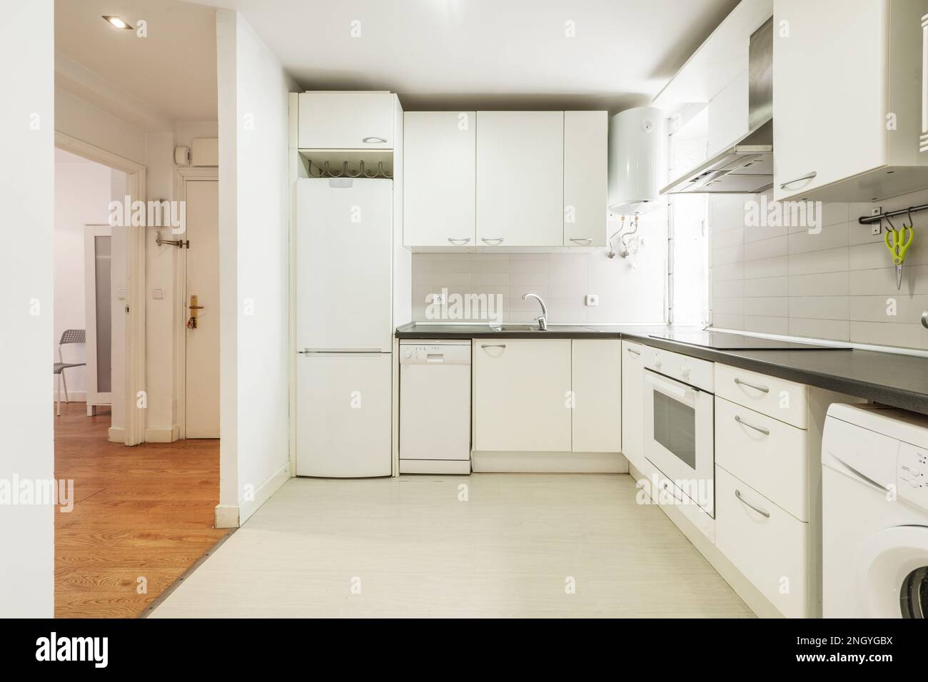 kitchen with smooth white gray stone countertops, white tile