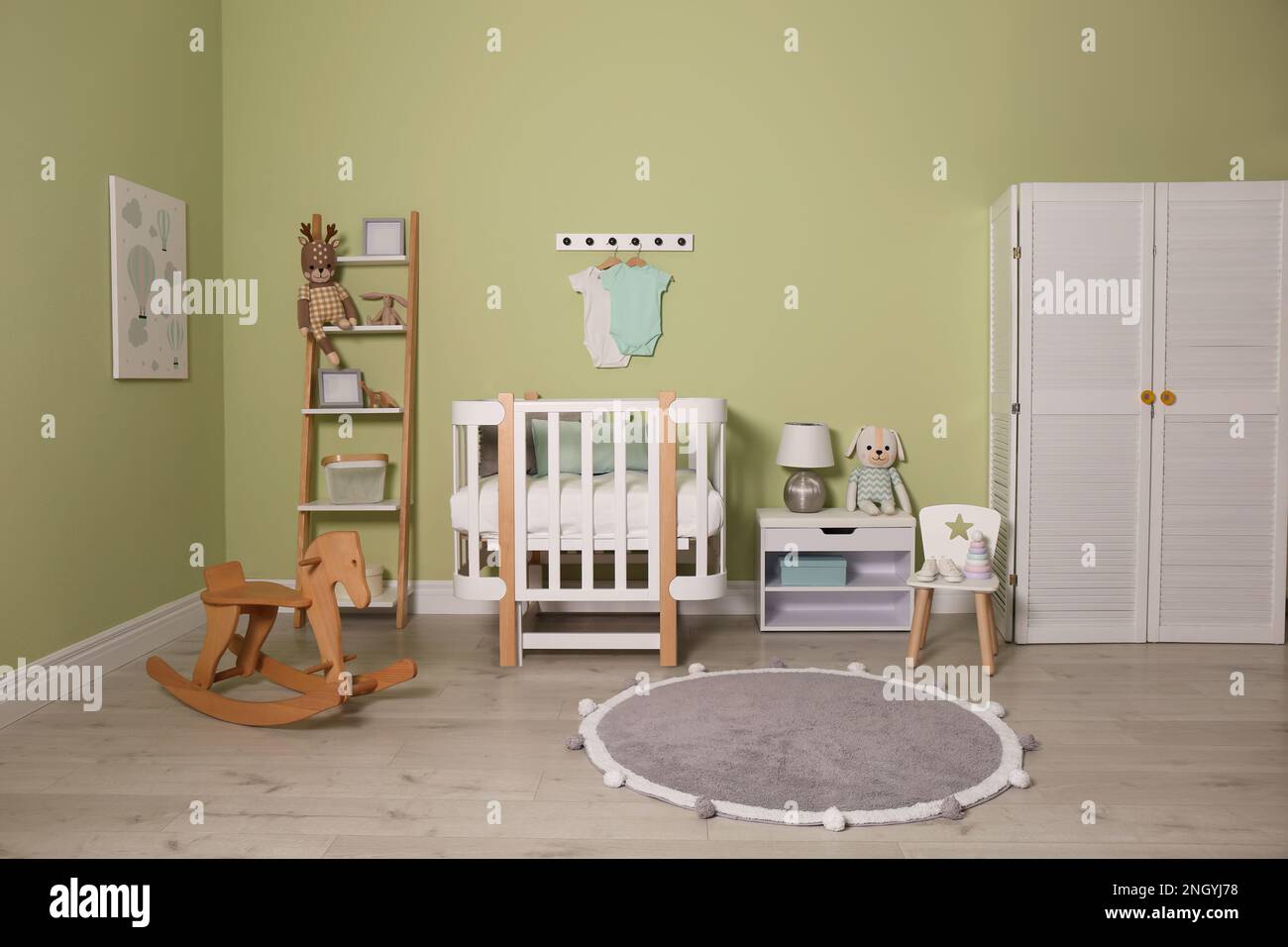 Baby room interior with stylish wooden furniture Stock Photo - Alamy
