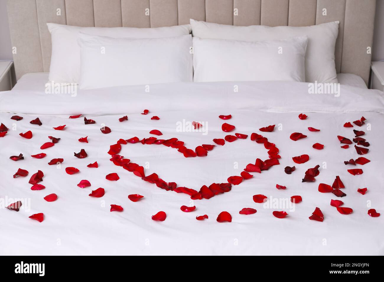 Beautiful heart of red rose petals on bed Stock Photo Alamy