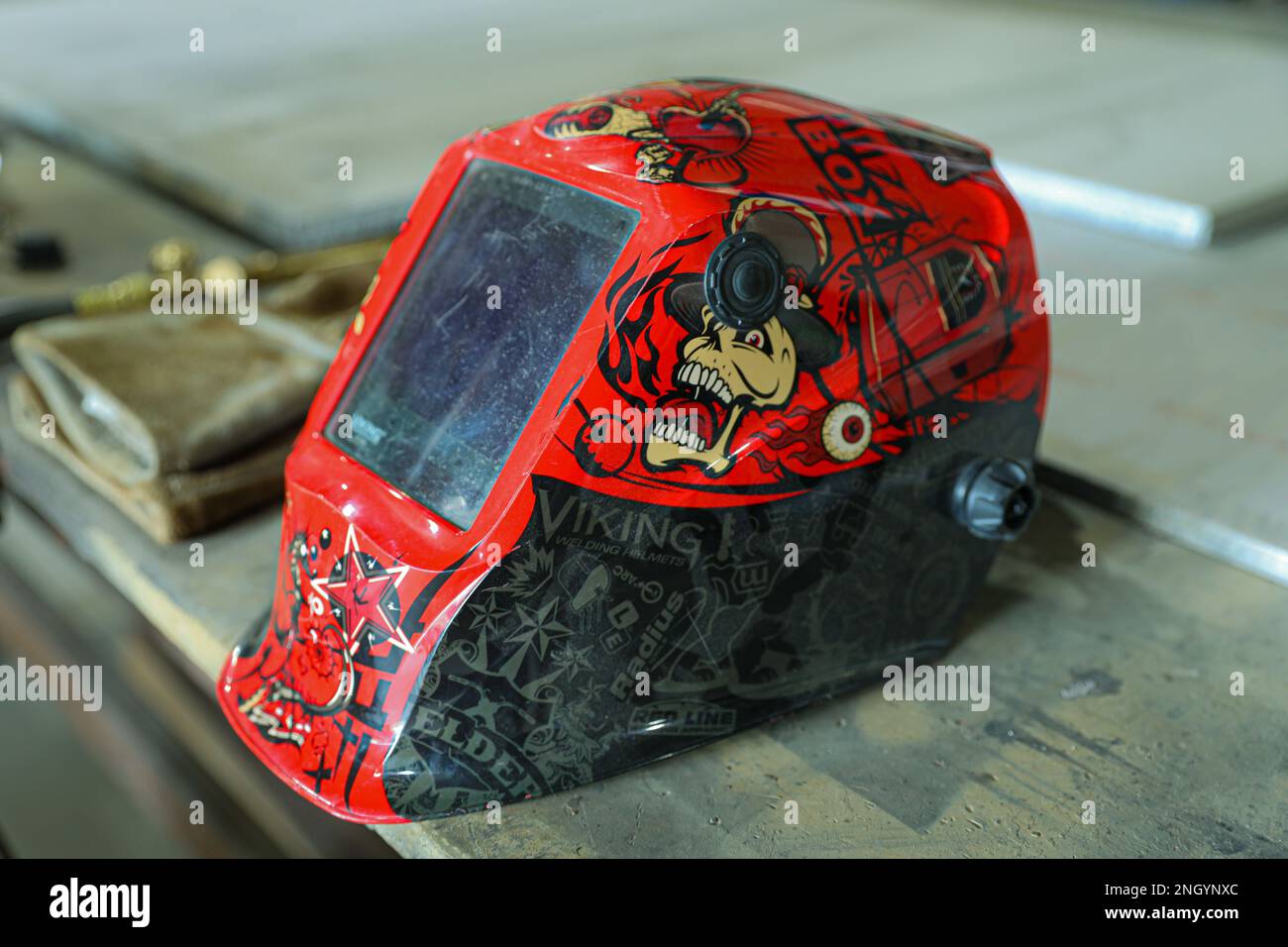 A red welding helmet rests on a table inside of the 783rd SMC’s
