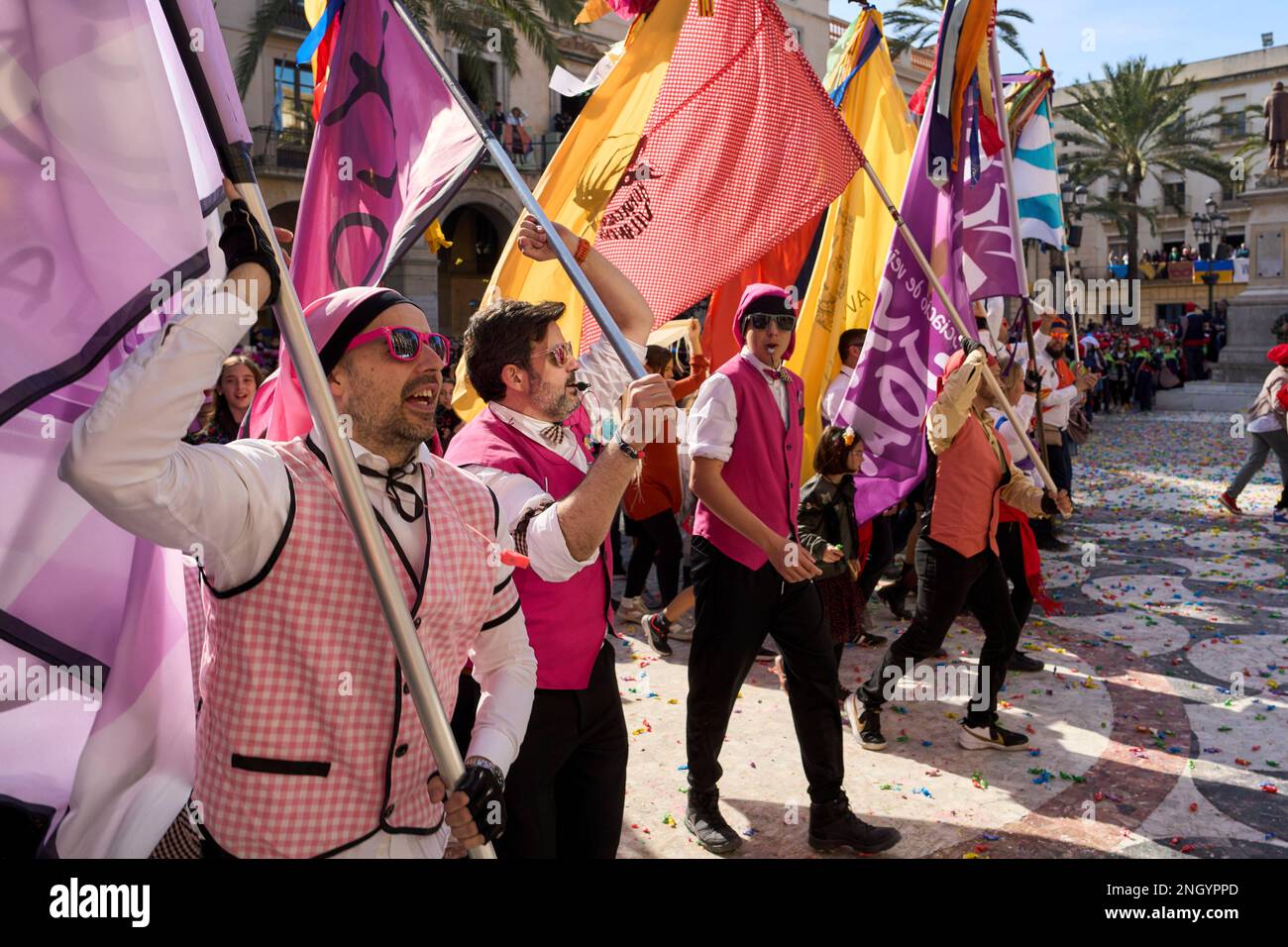 February 19, 2023, Vilanova i la geltru, Catalonia, Spain: The coastal city of Vilanova i la Geltru, close to Barcelona, celebrates one of the most traditional and different carnivals in the world, where its citizens dress in old clothing and while waving the flags of each family or â€œcollaâ€, they arrive in the square central city where they have a big candy war. (Credit Image: © Eric Renom/ZUMA Press Wire) EDITORIAL USAGE ONLY! Not for Commercial USAGE! Stock Photo