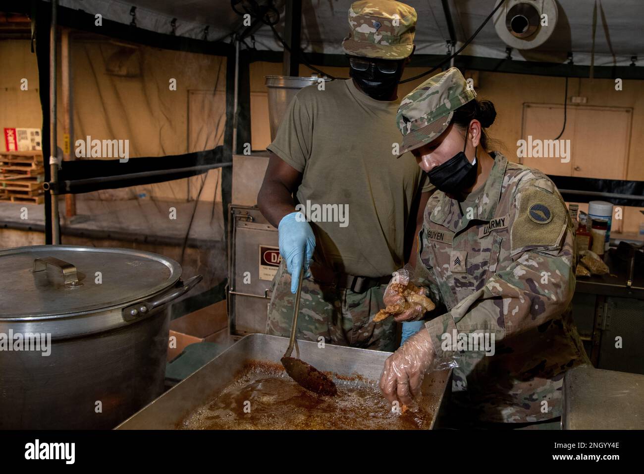 From Left, U.S. Army Soldiers Spc. Tyre Strong And Sgt. Nhien Nguyen ...