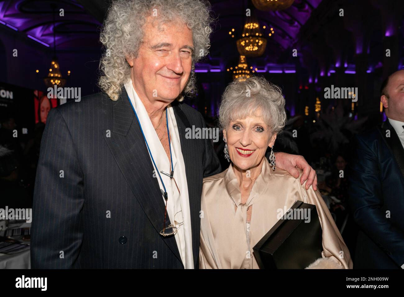 London, UK. 17th Feb, 2023. Actress Lady Anita May Dobson (R) winner of an Icon award with her husband Sir Brian May (L) of the band Queen. This Is Icon Awards part of London Fashion Week held a celebrity awards gala on the 17th February at the De Vere Grand Connaught Rooms London in Aid of charity Prost8organized by Buzz Talent. Credit: SOPA Images Limited/Alamy Live News Stock Photo