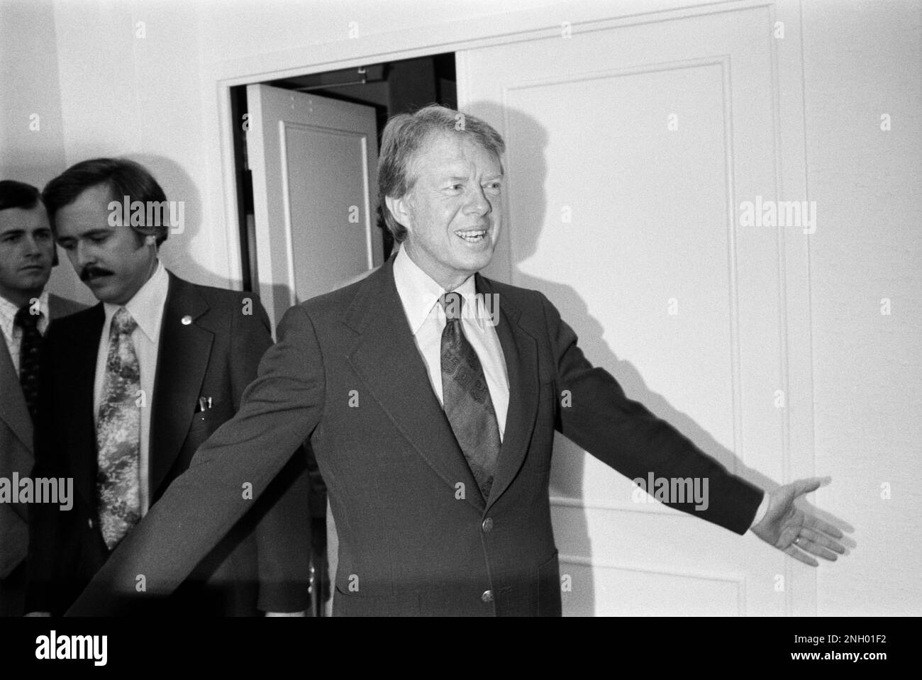 Democratic presidential nominee Jimmy Carter enters a meeting in