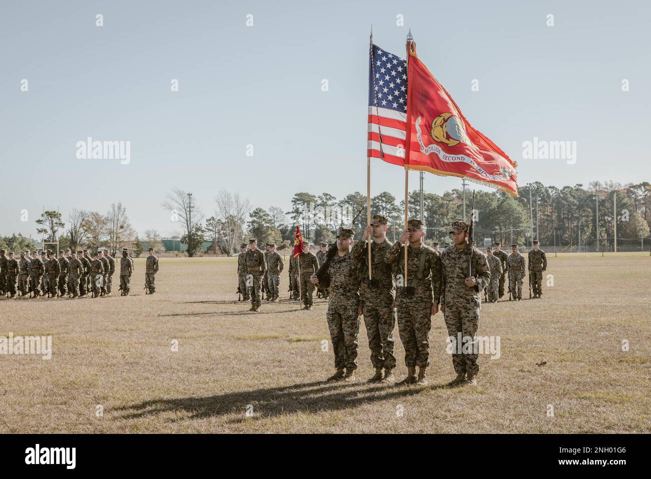 A U.S. Marine Corps color guard with 3rd Battalion, 2d Marine Regiment, 2d Marine Division, marches the regimental colors at a change of command ceremony on Camp Lejeune, North Carolina, Dec. 2, 2022. During the ceremony, Lt. Col. Charles C. Nash, the outgoing commander of 3/2, relinquished command to Lt. Col. John F. Campbell. Stock Photo