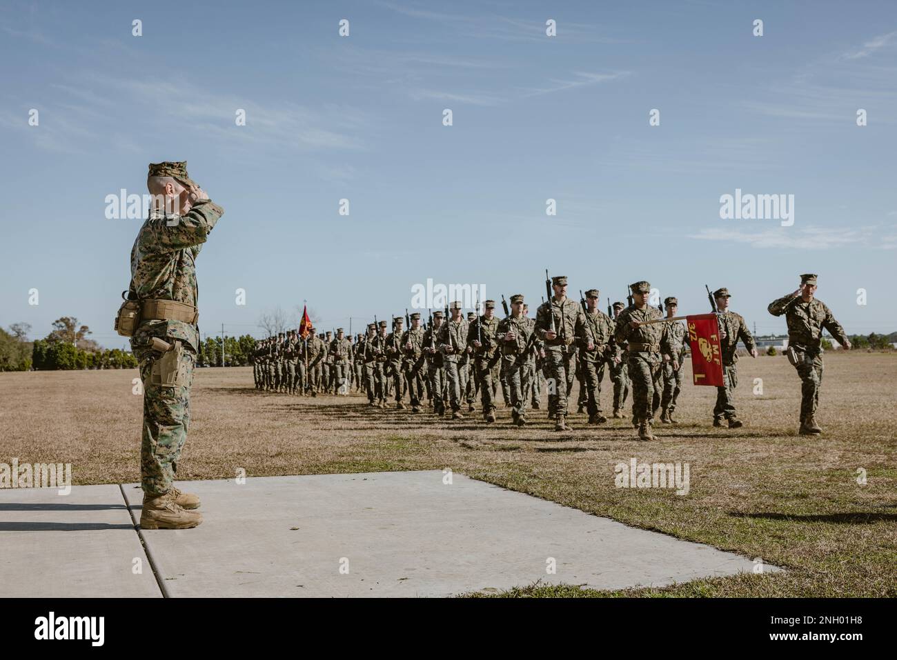 U.S. Marines with 3rd Battalion, 2d Marine Regiment, 2d Marine Division, conduct a pass and review at a change of command ceremony on Camp Lejeune, North Carolina, Dec. 2, 2022. During the ceremony, Lt. Col. Charles C. Nash, the outgoing commander of 3rd Battalion, 2d Marine Regiment relinquished command to Lt. Col. John F. Campbell. Stock Photo