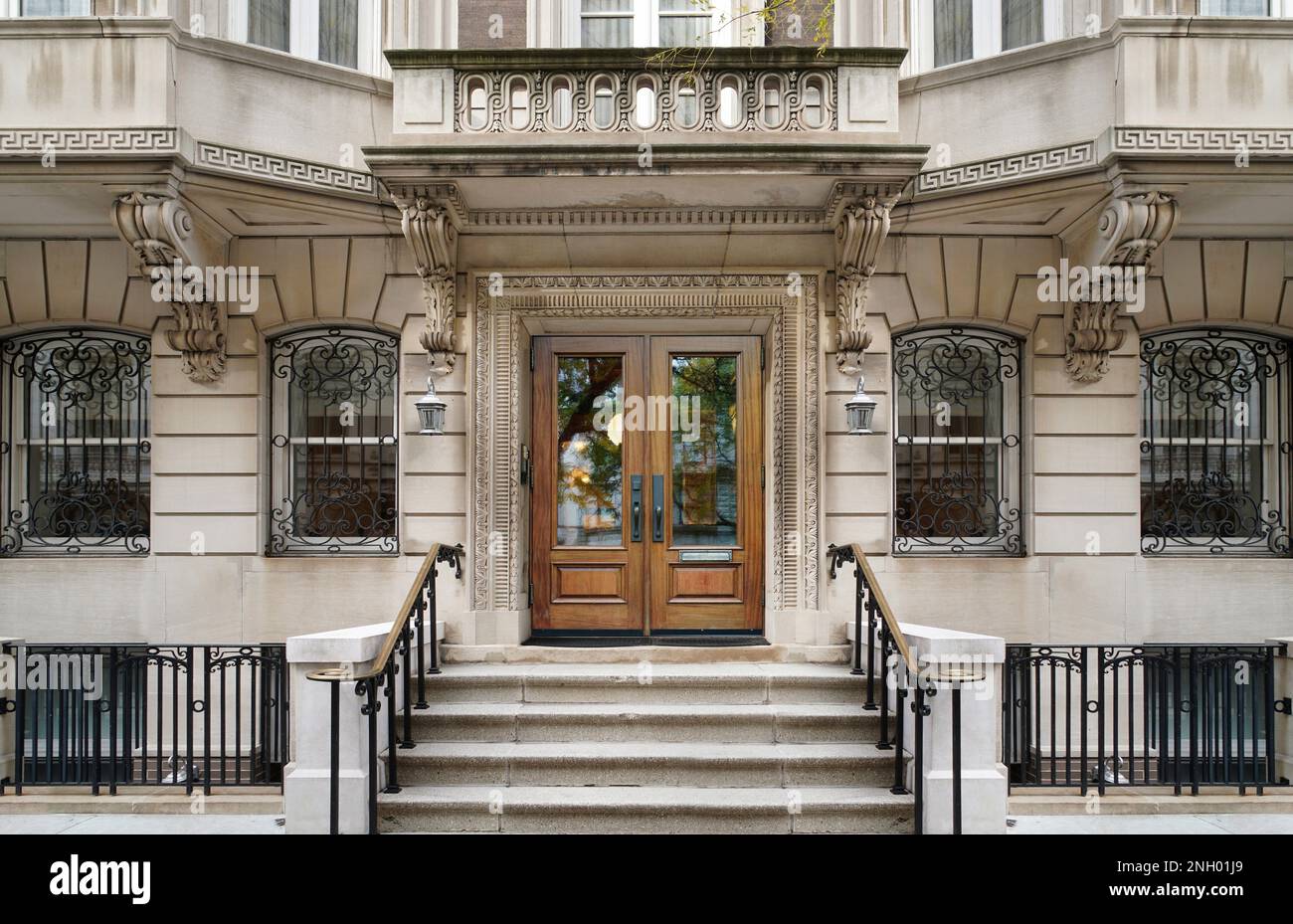 Entrance to elegant New York apartment building with stone detailing Stock Photo