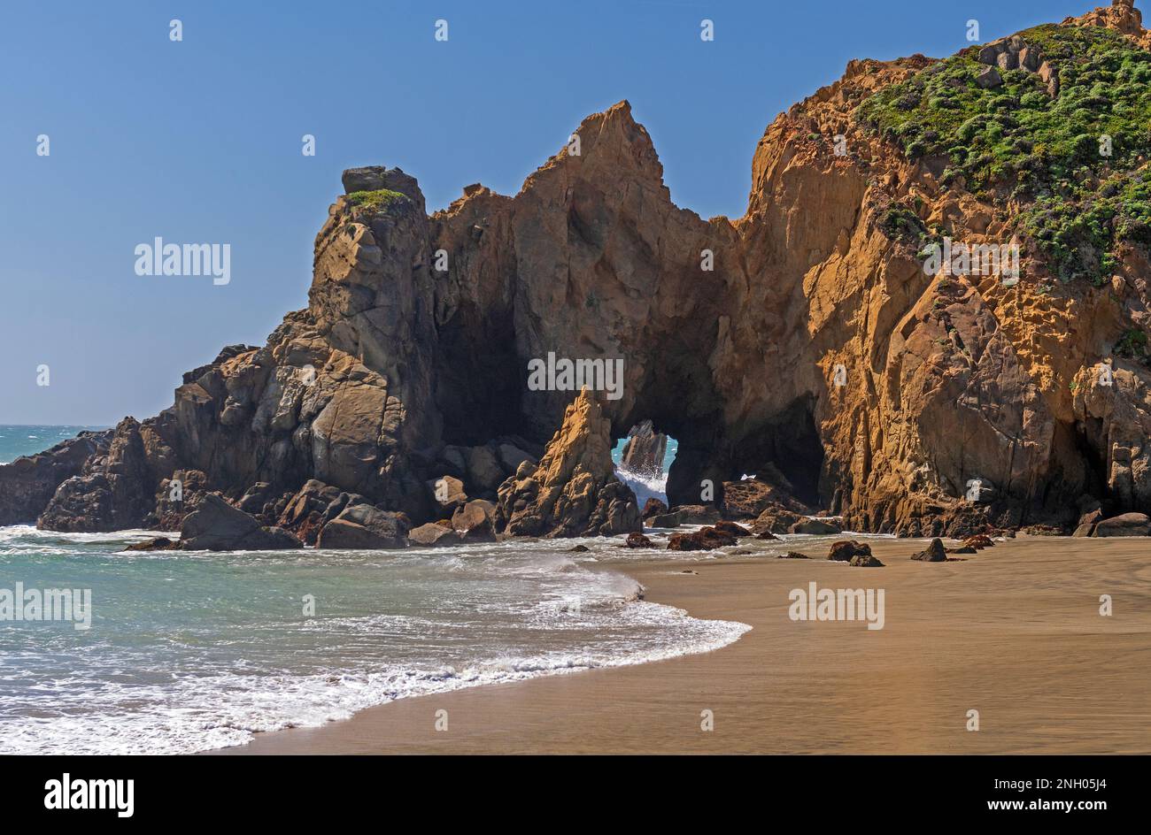Jagged Sea Stack on a Coastal Beach at Pfeiffer Big Sur State Park in California Stock Photo
