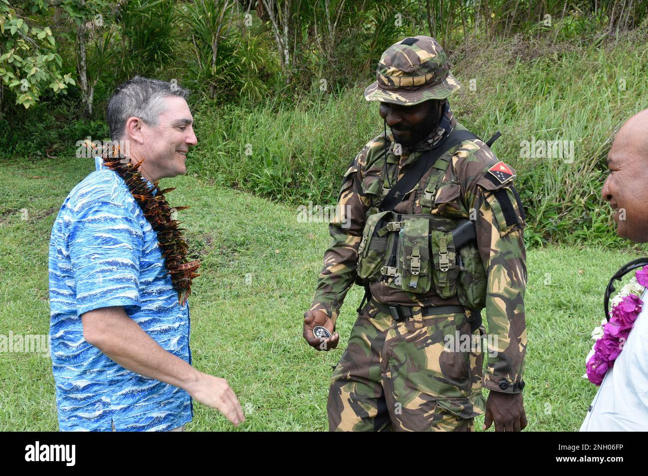 Maj. Gen. Paul Knapp, Wisconsin’s adjutant general, presents his coin