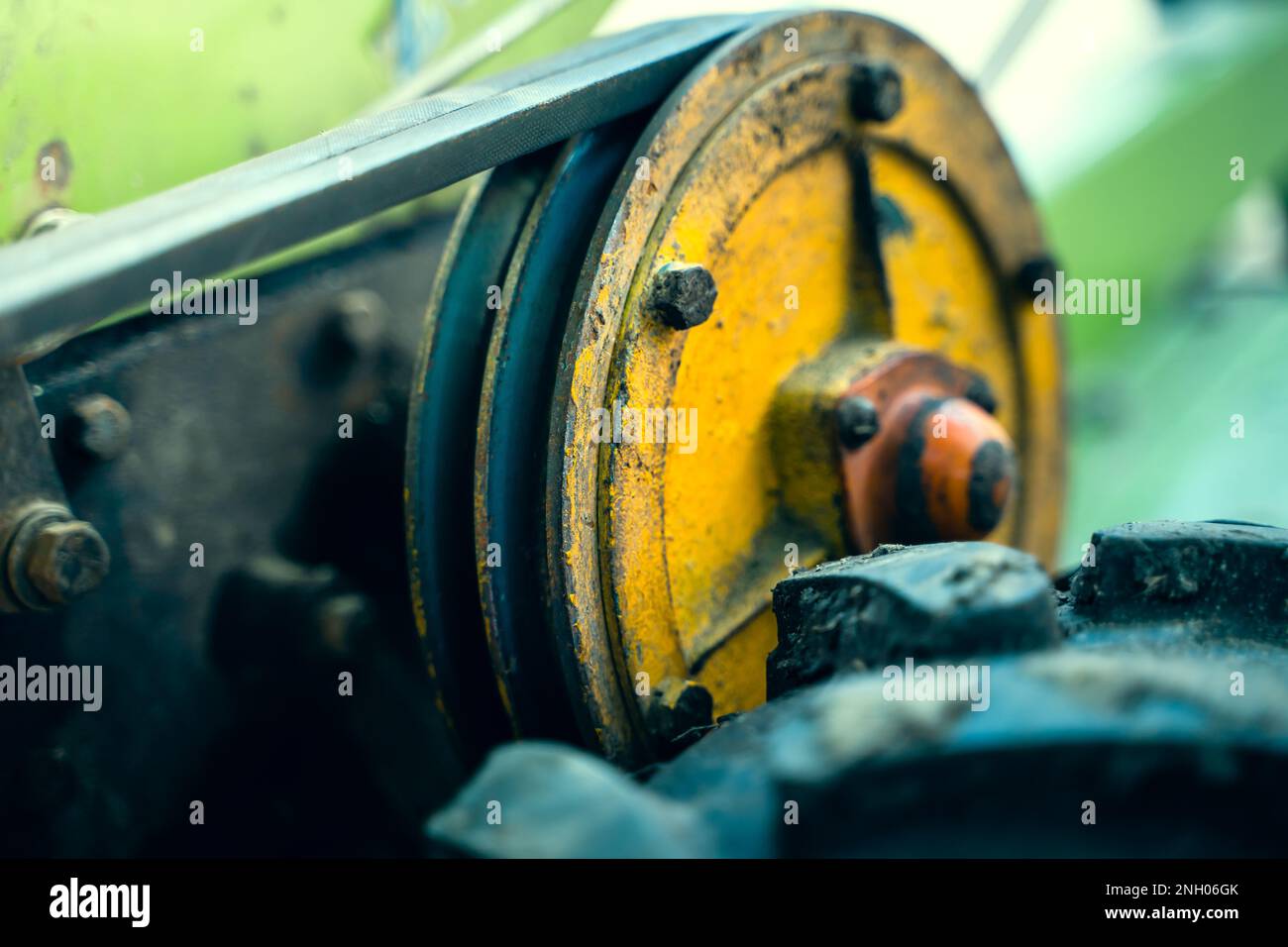 Walkbehind tractor pulley with two belts closeup. Tractor for