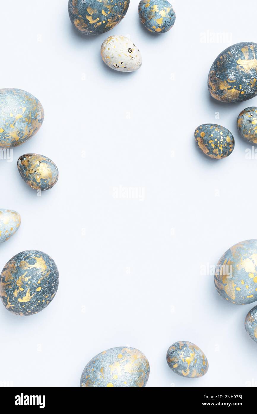 Blue Easter eggs frame. Light Easter background or elegant greeting card, copy space. Stock Photo