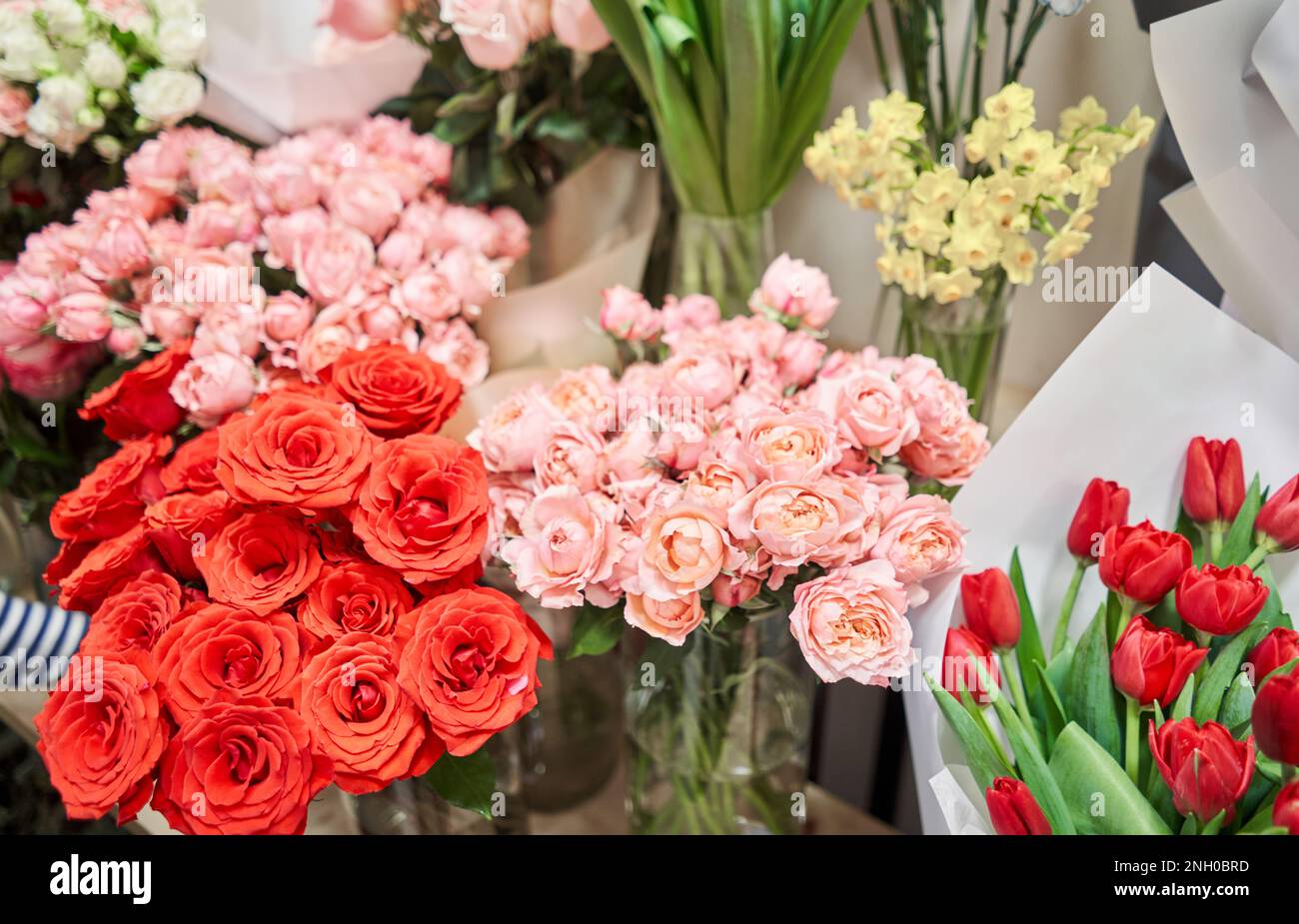 Flower shop concept. Different varieties fresh spring flowers in