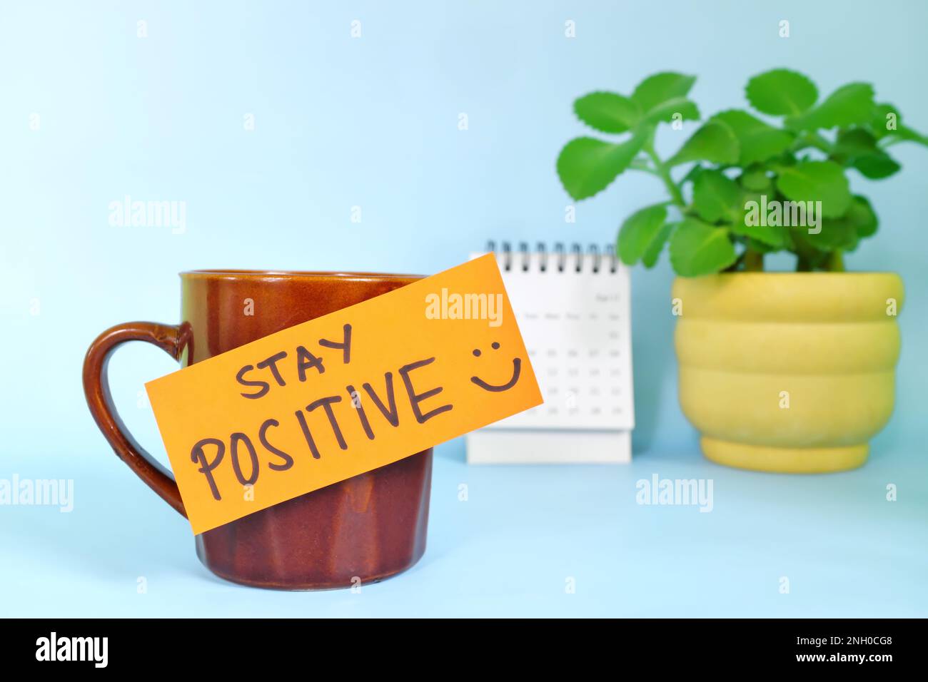 https://c8.alamy.com/comp/2NH0CG8/stay-positive-positivity-reminder-concept-selective-focus-of-a-cup-of-coffee-with-handwritten-bright-paper-message-note-2NH0CG8.jpg