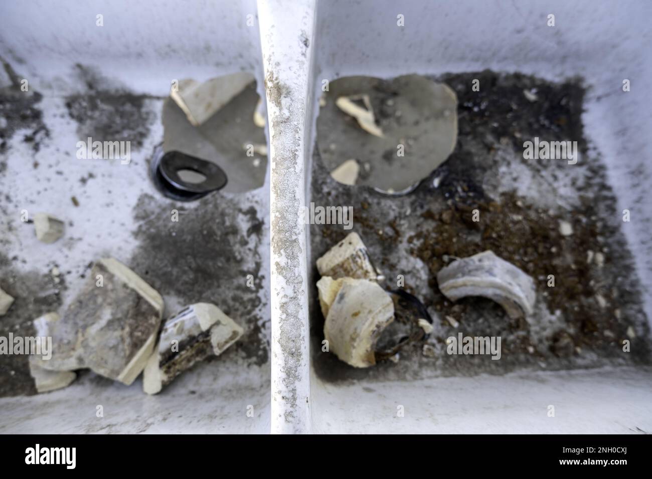 Detail of old broken ceramic sink in the garbage Stock Photo Alamy