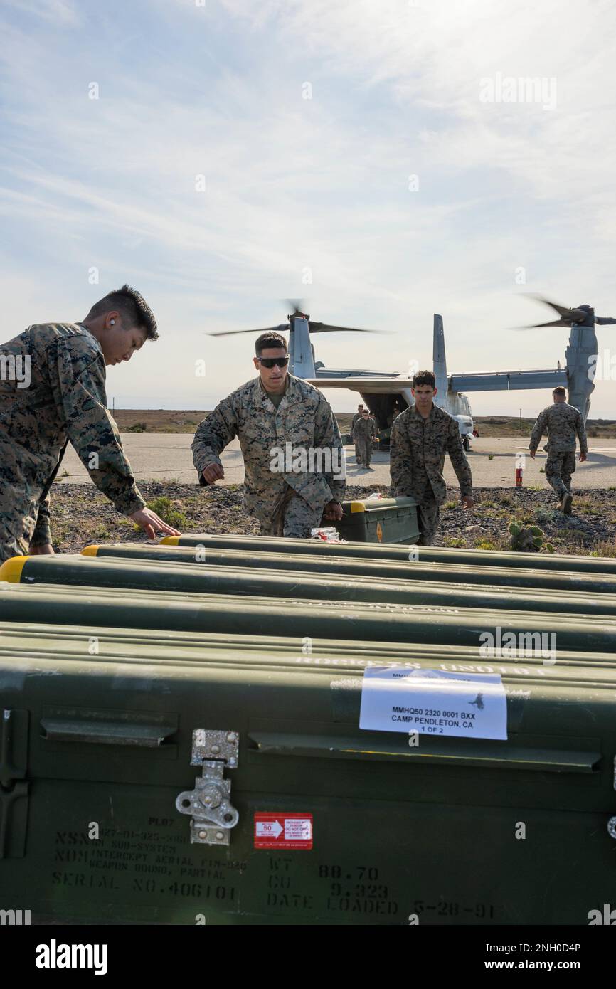 U.S. Marines with 3rd Low Altitude Air Defense Battalion, Marine Air Control Group 38, 3rd Marine Aircraft Wing (MAW), offload Stinger missiles from an MV-22B Osprey during exercise Steel Knight 23 on San Clemente Island, California, Dec. 3, 2022. Exercise Steel Knight 23 provides 3rd MAW an opportunity to refine Wing-level warfighting in support of I Marine Expeditionary Force and fleet maneuver. Stock Photo