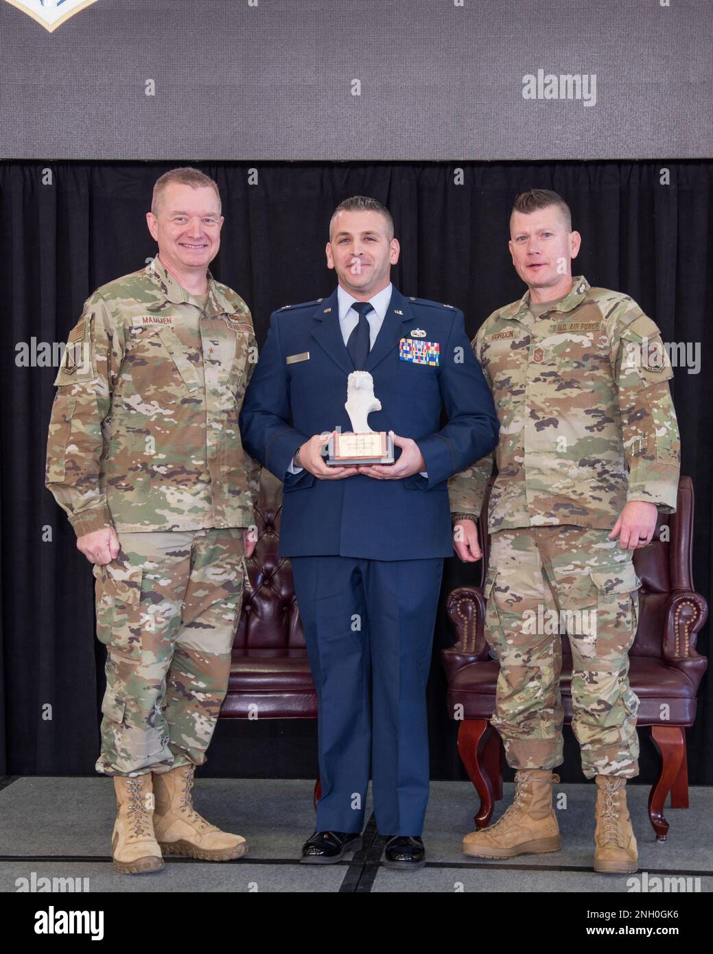 Brig. Gen. Rolf Mammen, 127th Wing Commander, Capt. Charles DiCiuccio, maintenance operations officer, 127th Aircraft Maintenance Squadron and Chief Master Sgt. Rick Gordon, 127th Wing command chief, based in Selfridge Air National Guard Base, Michigan, pose after awarding DiCiuccio the Wing’s outstanding company grade officer of the year award. DiCiuccio and seven other individuals were awarded in different categories based on rank and will advance to the Michigan Air National Guard competition. Stock Photo