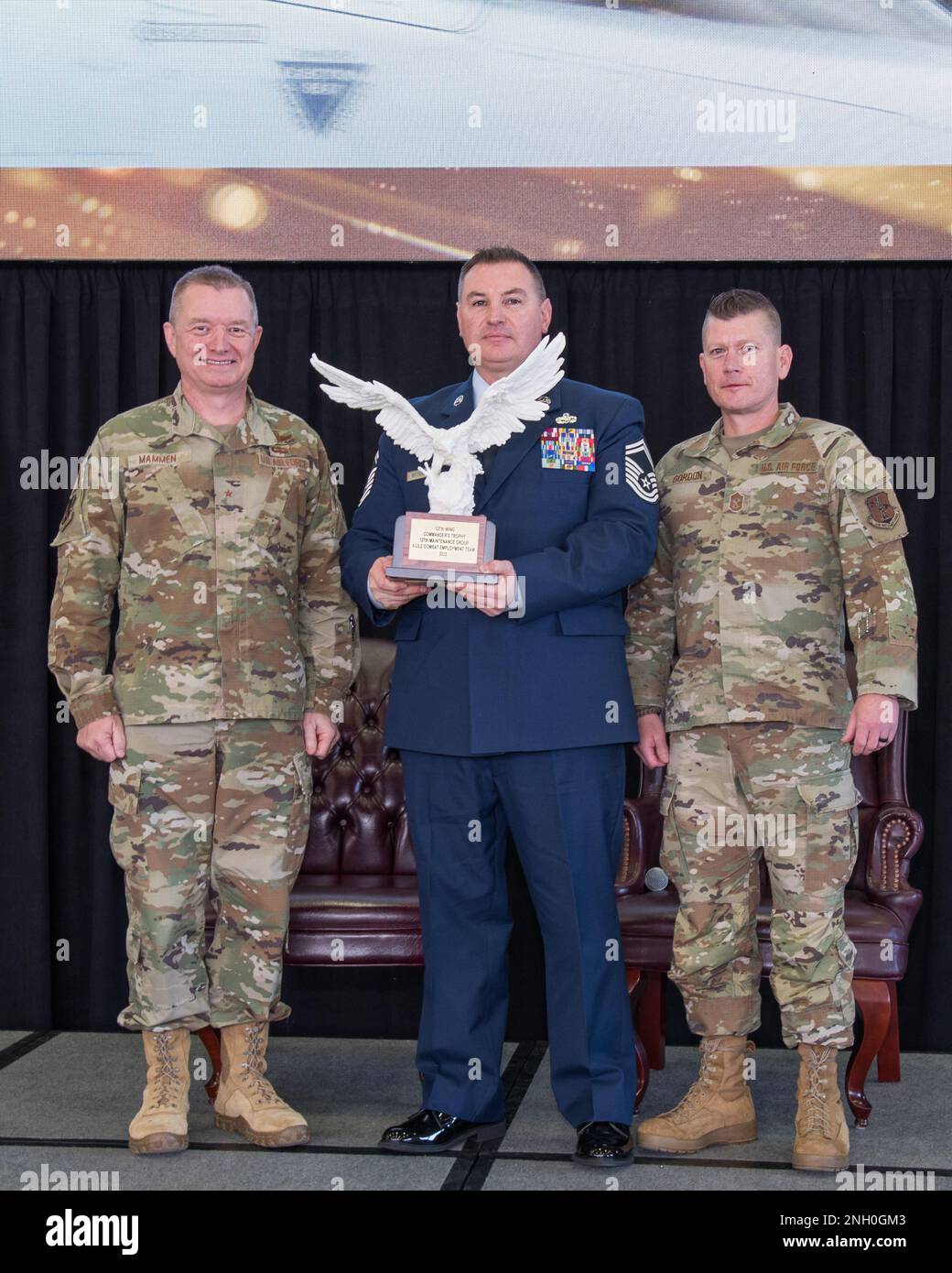 Brig. Gen. Rolf Mammen, 127th Wing Commander, Senior Master Sgt. Adam Dittenber, aircraft maintenance section chief, 127th Aircraft Maintenance Squadron and Chief Master Sgt. Rick Gordon, 127th Wing command chief, based in Selfridge Air National Guard Base, Michigan, pose after Dittenber acceptd the Commander's Trophy on behalf of the 127th Maintenance Group's, Agile Combat Employment team. The ACE team and eight individuals were honored for outstanding performance in a variety of categories for the 2022 calendar year. Stock Photo