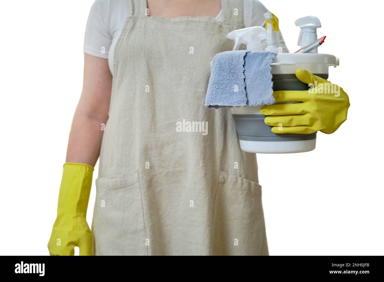 A woman with a bucket and a rag while cleaning in the home kitchen, a ...