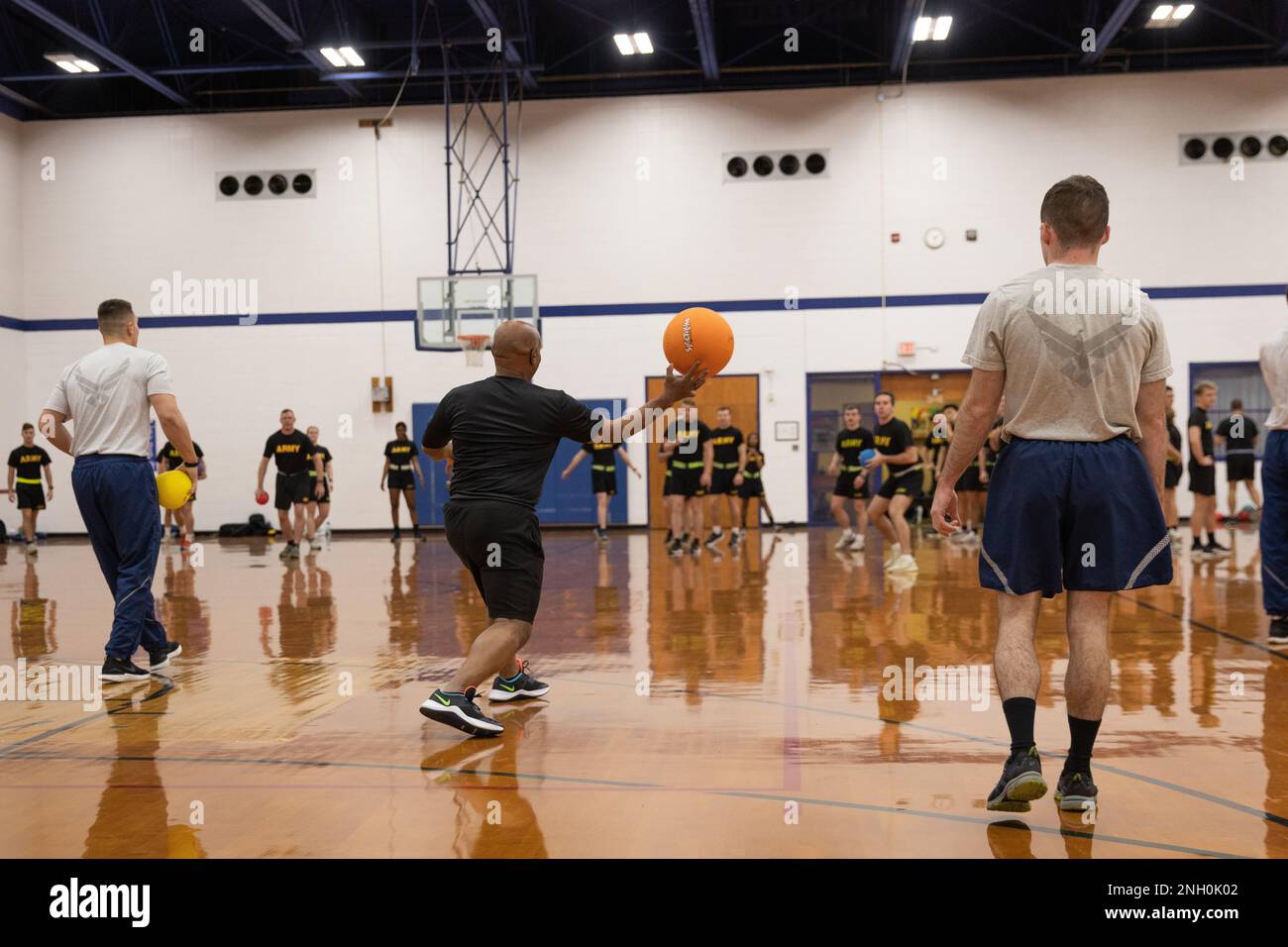 Senior Enlisted Advisor Tony Whitehead participates in dodgeball during physical training with