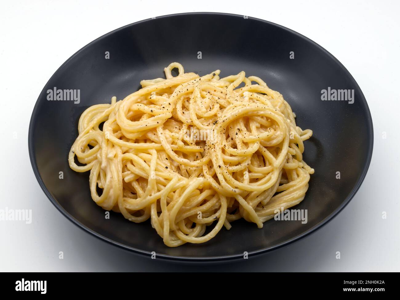 Spaghetti cacio e pepe isolated on white background. Stock Photo