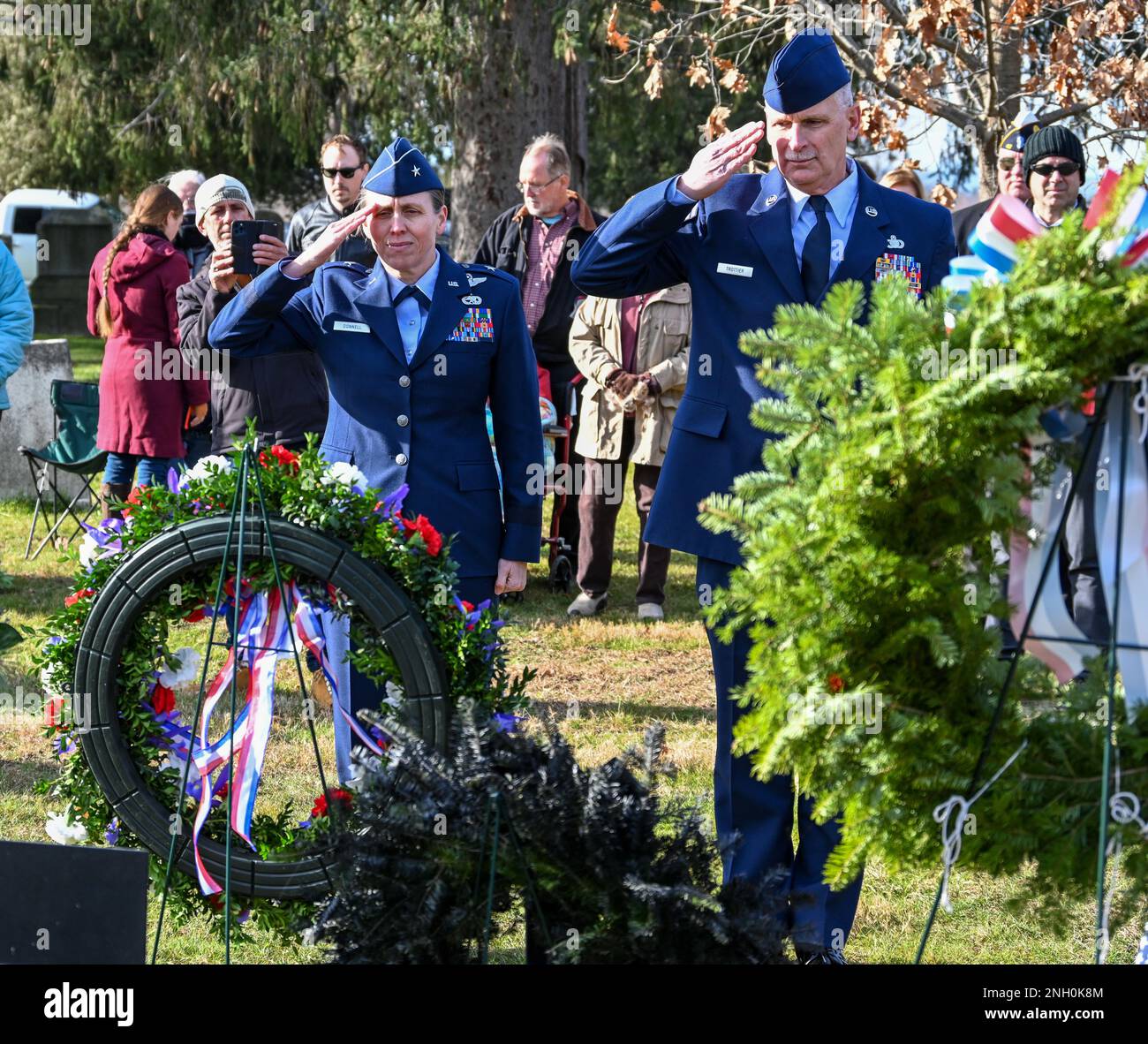 Brig. General Denise Donnell, the commander of the New York Air National Guard, and Command Chief Master Sgt. Jeffery Trottier, salute after placing a wreath from President Joseph Biden at the grave of President Martin Van Buren in Kinderhook, New York on the 240th anniversary of his birth on Dec. 5, 1872. Since 1967 military officers have presented a wreath from the current president at the gravesite of previous presidents on the anniversary of their birth. ( U.S. Army National Guard photo by Staff Sgt. Matthew Gunther) Stock Photo
