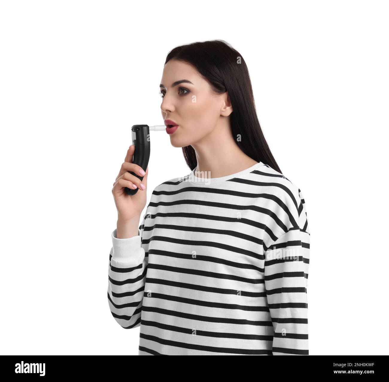 Woman blowing into breathalyzer on white background Stock Photo Alamy