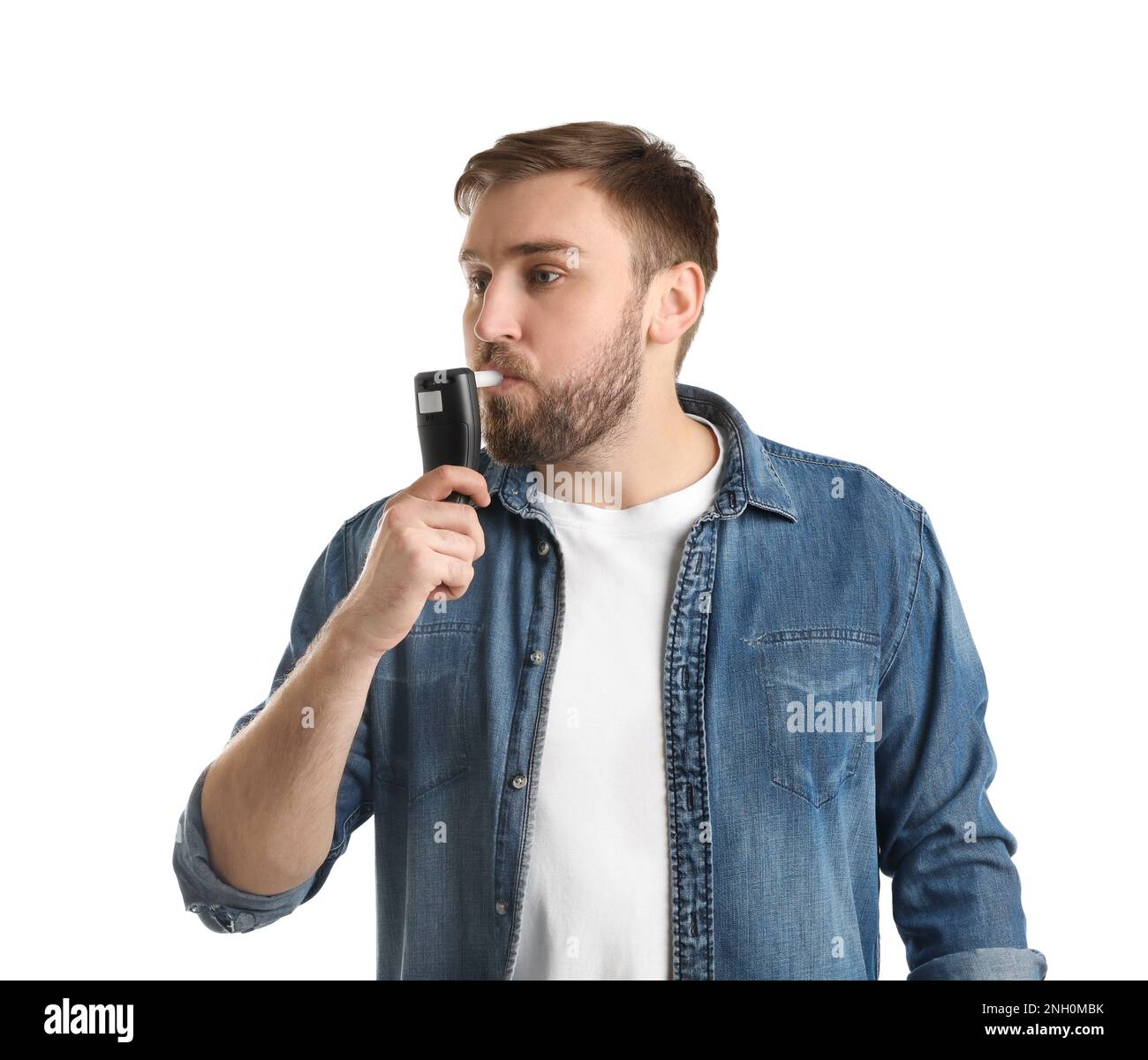 Man blowing into breathalyzer on white background Stock Photo Alamy