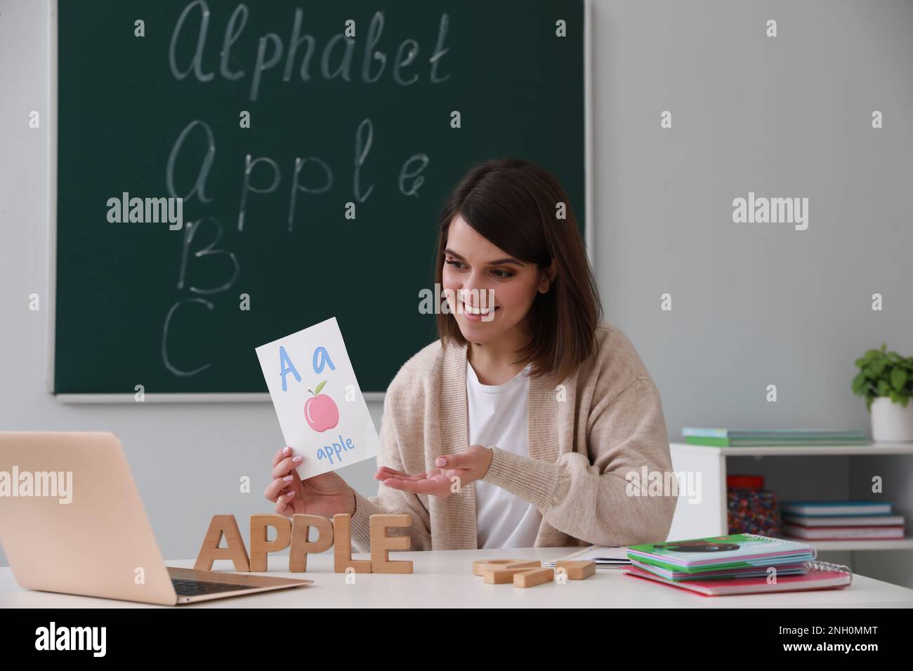 Happy English teacher giving online lesson. Early childhood education