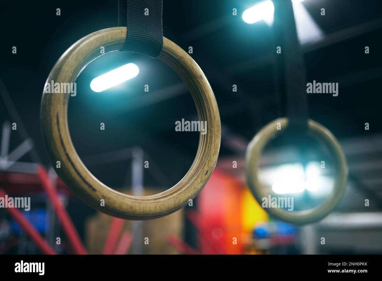 Gymnastics ring, training and equipment in an empty gym for olympics