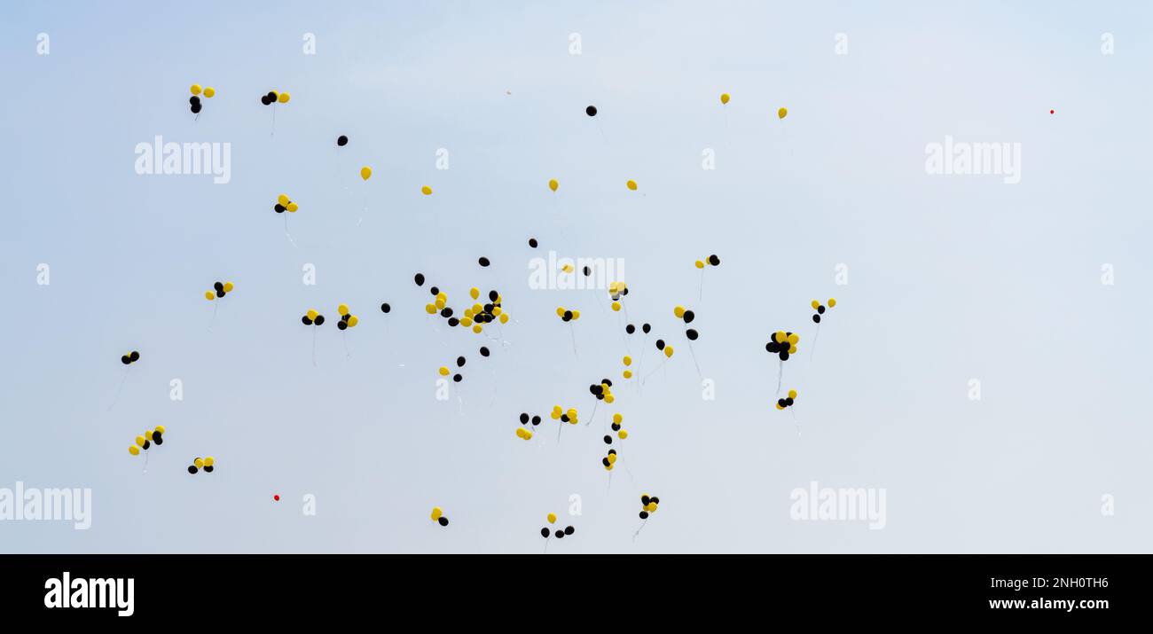 Many balloons in the blue sky. Stock Photo