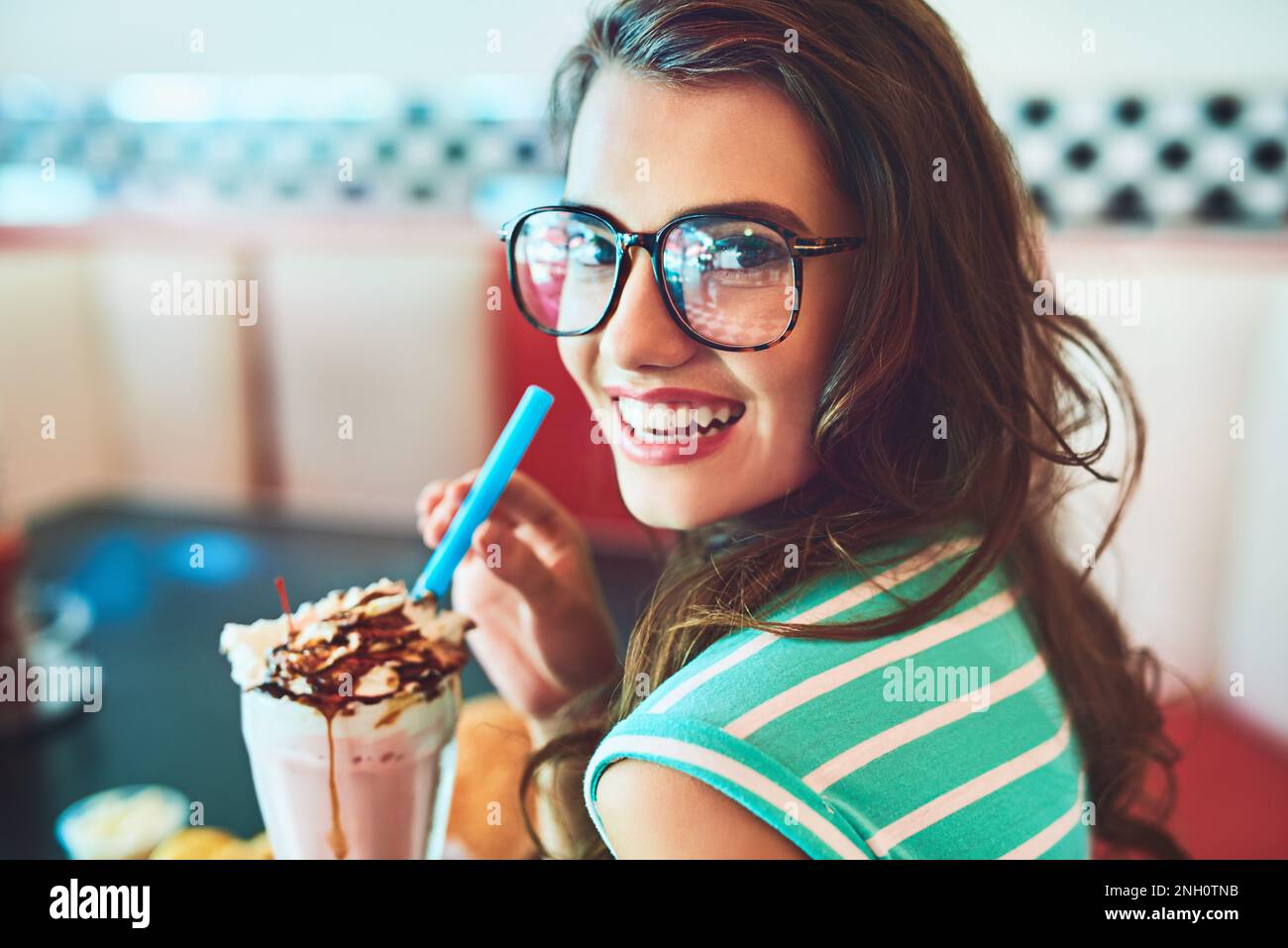 This place is famous for its milkshakes. Cropped portrait of an