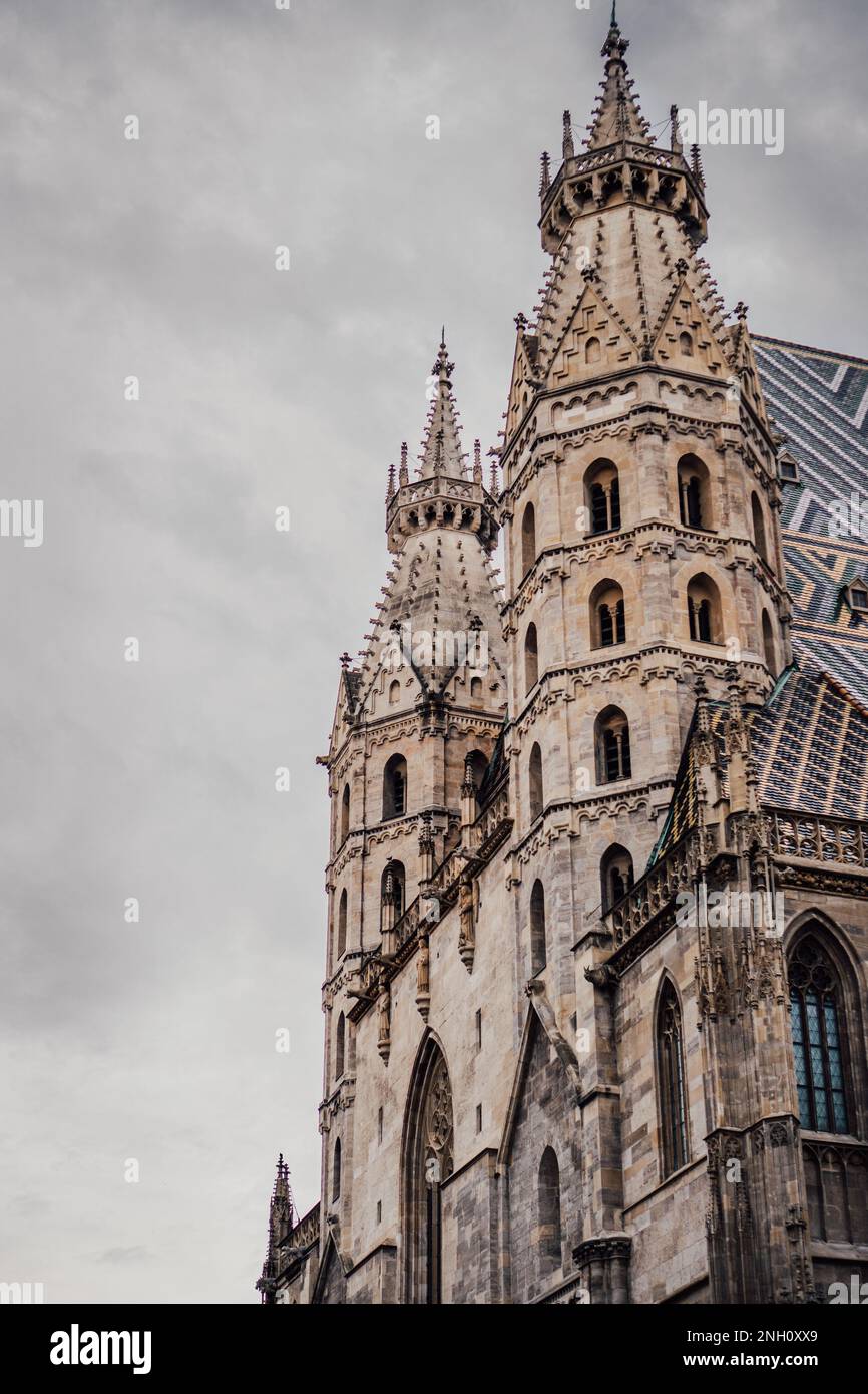 An aerial view of a metropolis skyline featuring two towers adorned