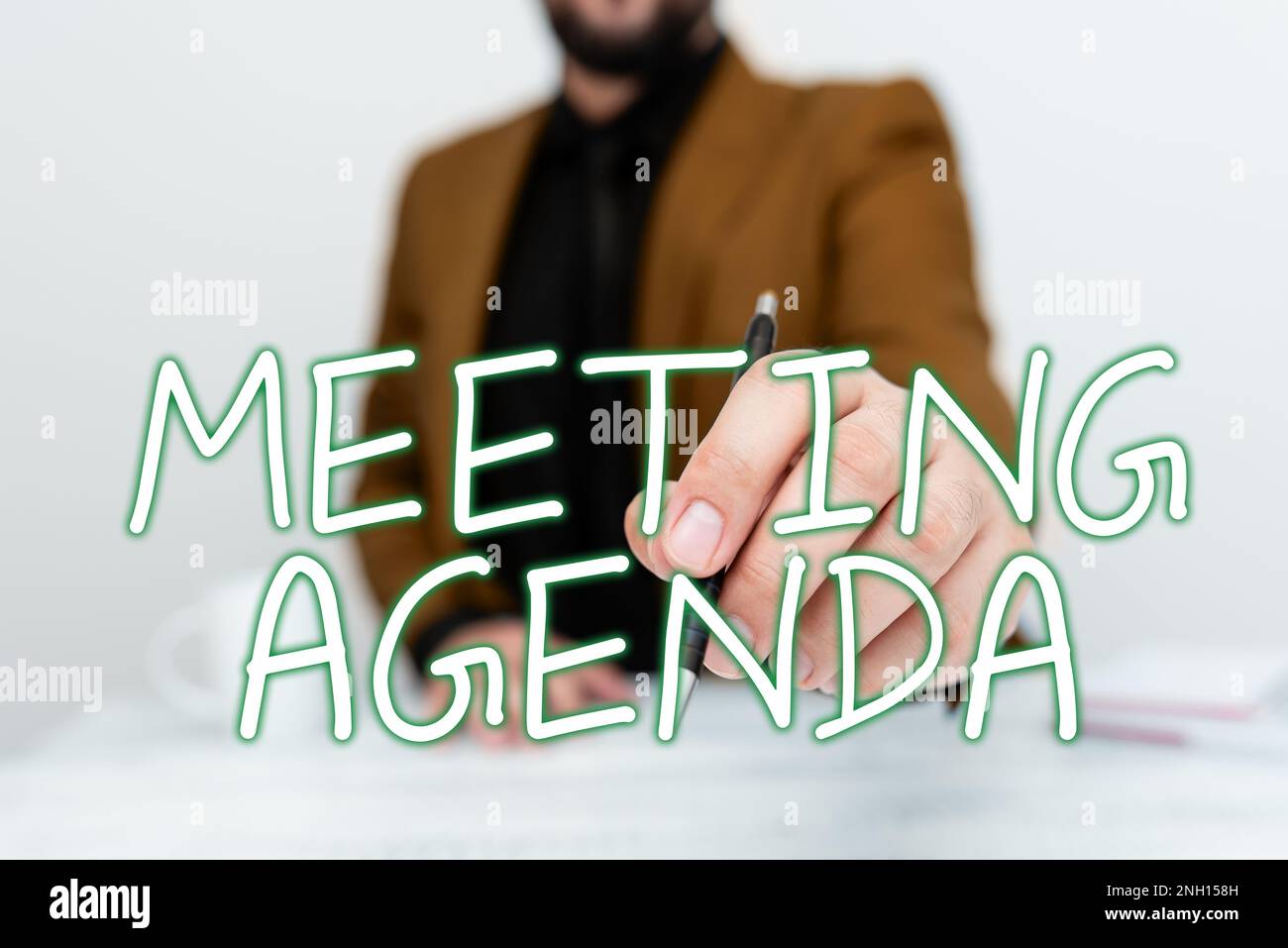 Hand writing sign Meeting Agenda, Word Written on An agenda sets clear ...