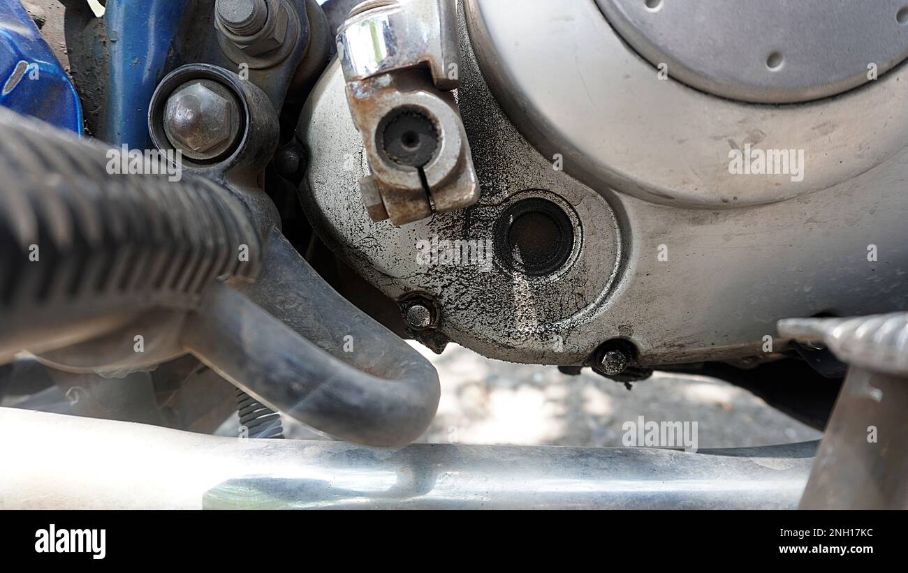 Transparent hole in the engine block that is dirty with oil. function