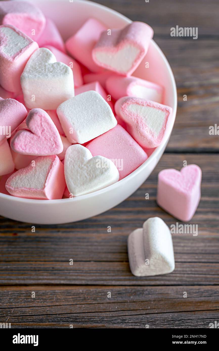White And Pink Heart Shaped Marshmallows In A Porcelain Bowl Over Pink And  Blue Background High-Res Stock Photo - Getty Images