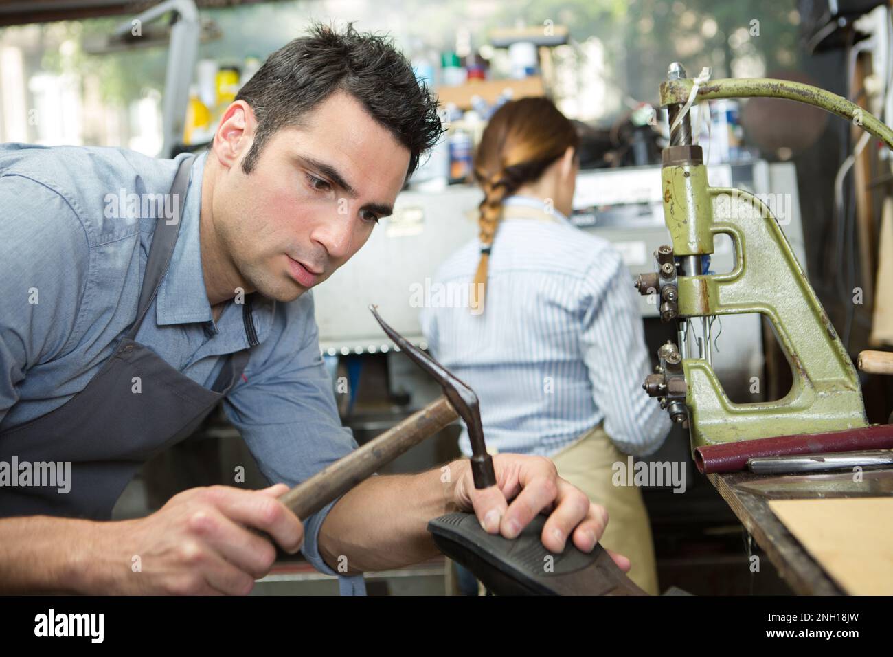 pciture of cobbler fixing a shoe sole Stock Photo - Alamy