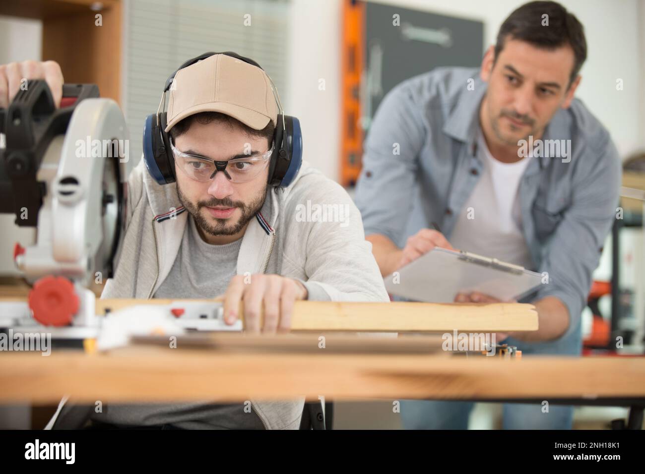 Male apprentice working carpenter in hi-res stock photography and ...