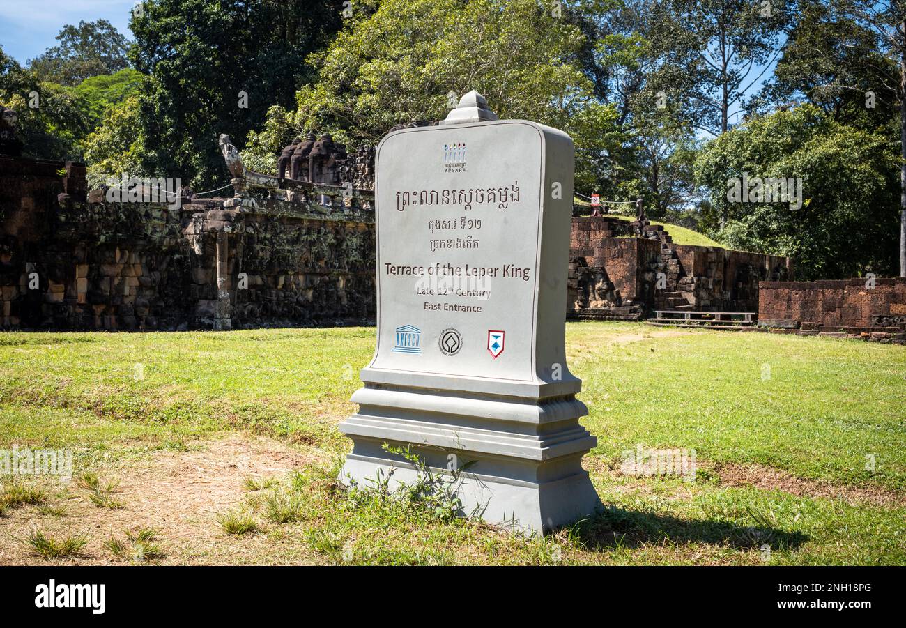 A modern concrete stele giving information about the Terrace of the Leper King within the famed Angkor complex in Cambodia. Stock Photo
