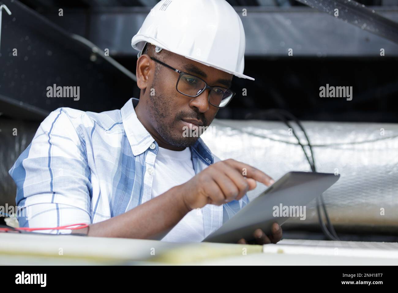 electrical engineer using a tablet Stock Photo