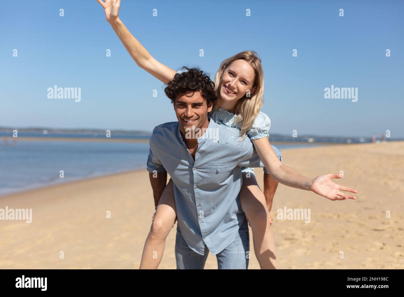 young couple having fun on the beach Stock Photo
