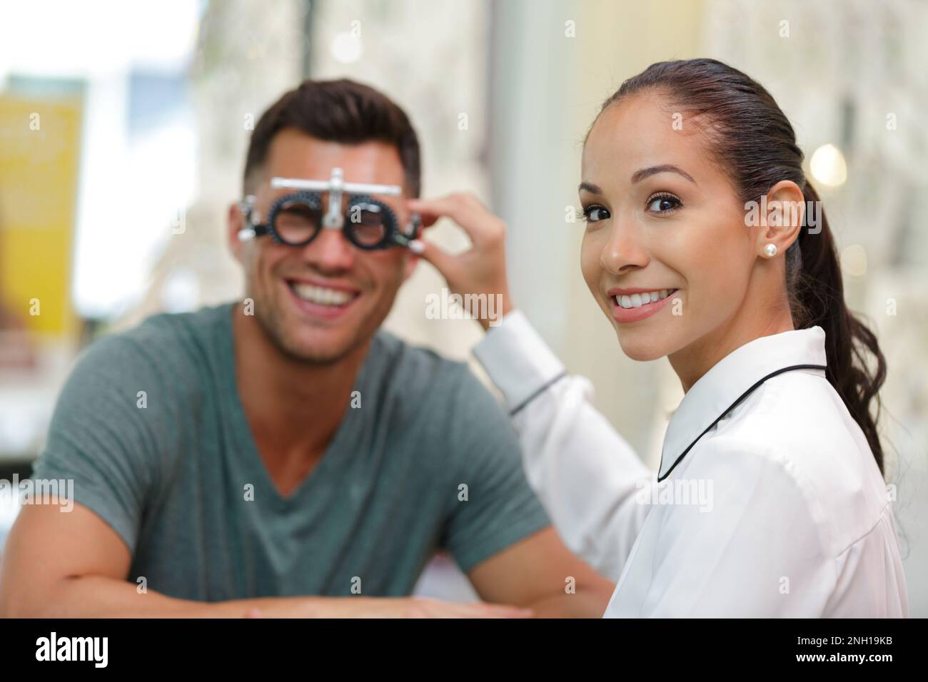 two people in an optical store Stock Photo Alamy